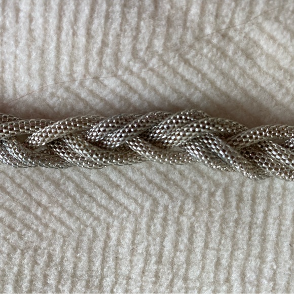 Cute Necklace Silver-tone braided, lightweight. Lays flat. Looks good. - Picture 3 of 6